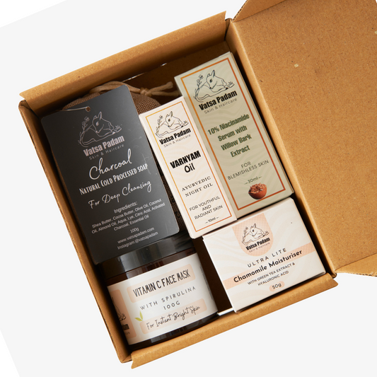 Open acne kit showing charcoal face wash, vitamin C mask, chamomile moisturiser and vamyam oil - complete anti acne facial kit with natural products